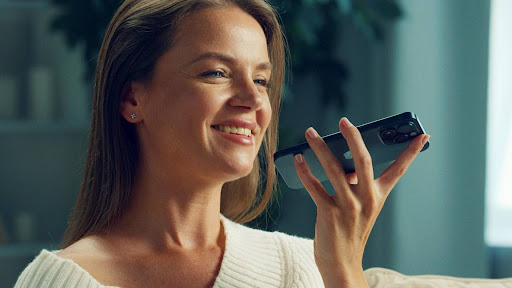 Woman speaking on the phone with loud speaker